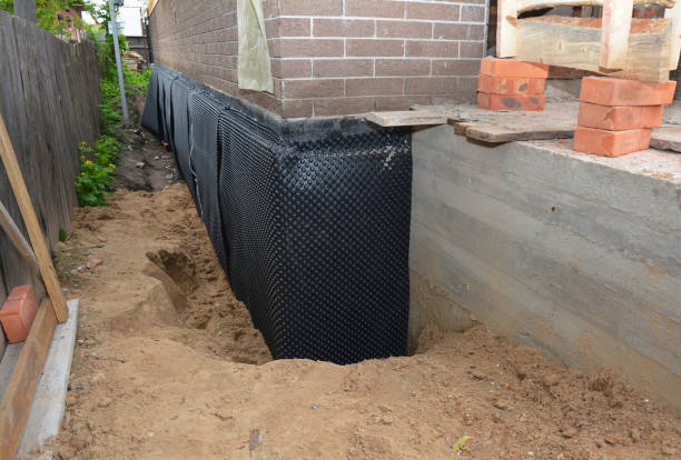 Happy homeowners after waterproofing job in La Porte
